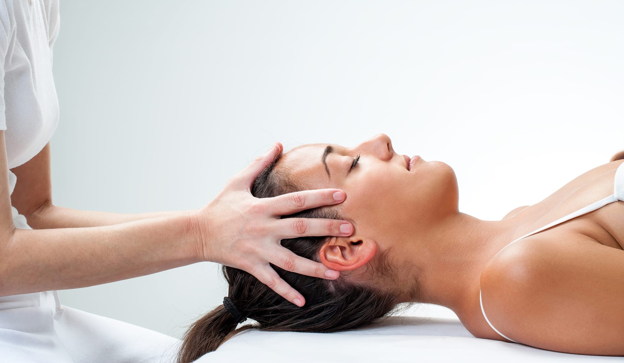 Healing osteopathic treatment on woman
